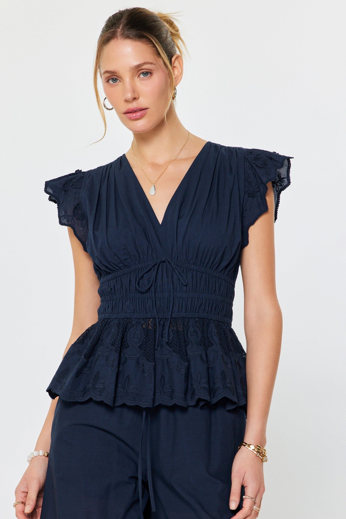 embroidered cotton peplum blouse with flutter sleeves