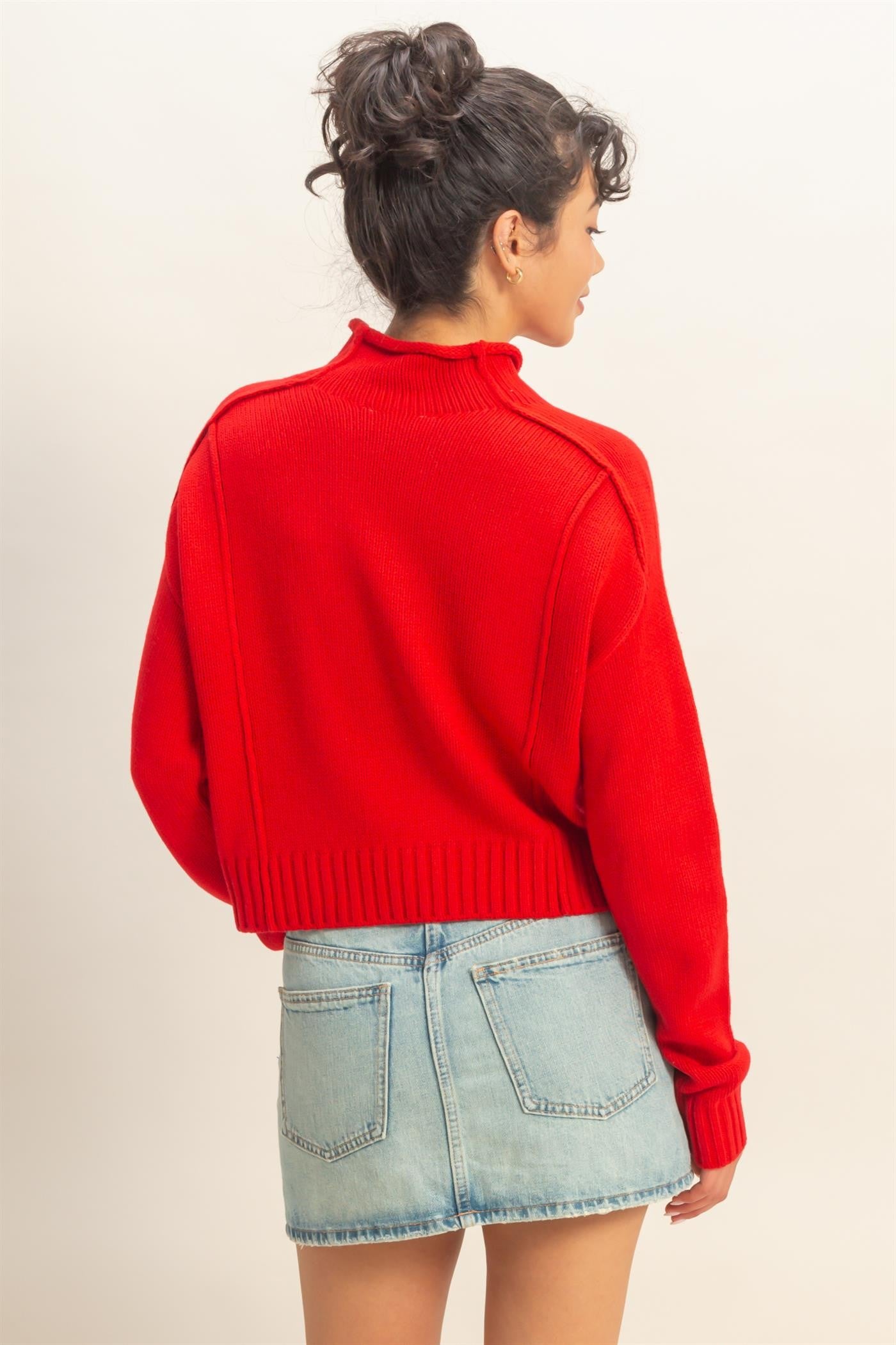 A cozy roll-neck sweater with seam detail and a relaxed fit for versatile, everyday styling.