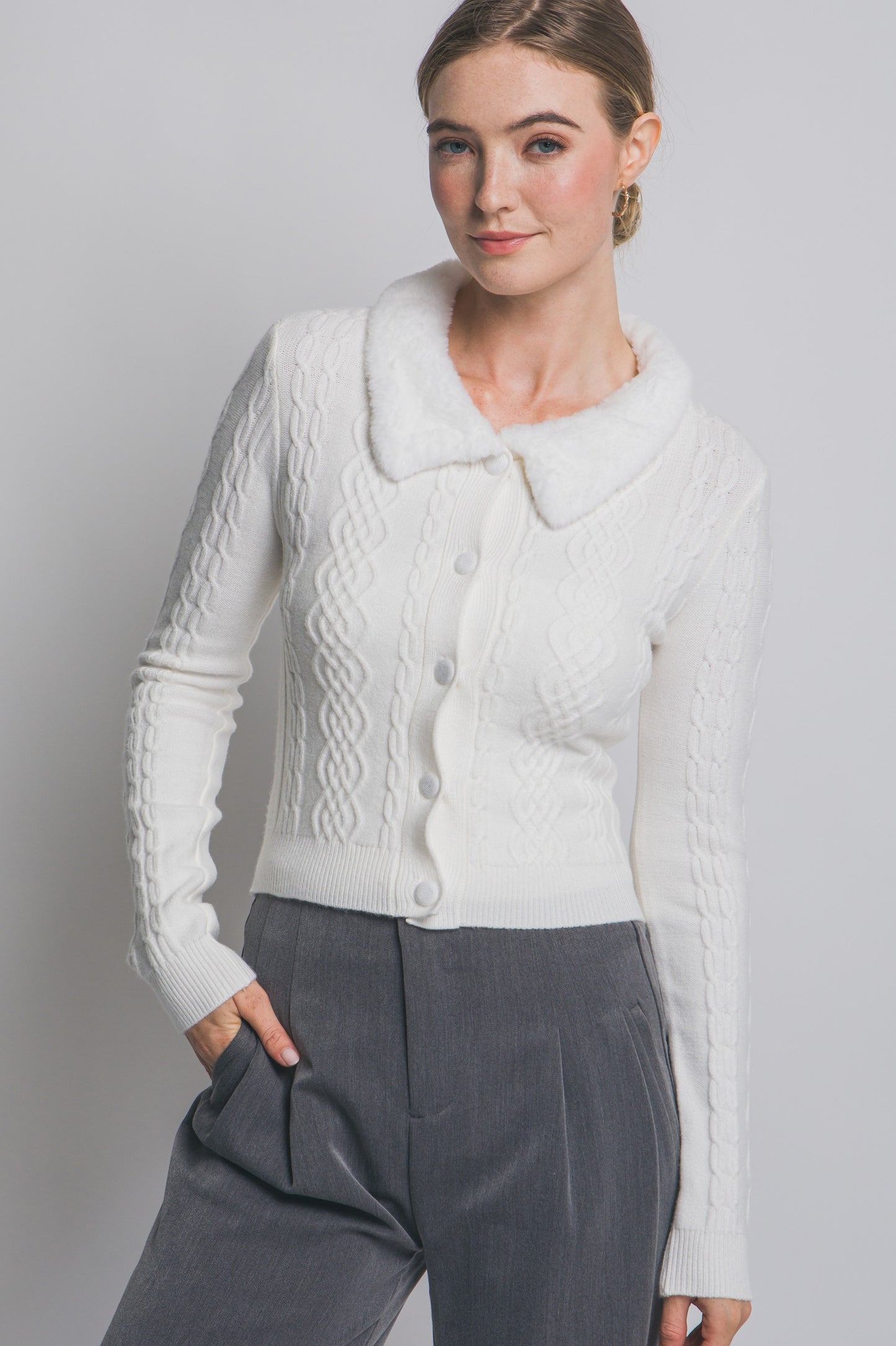 The Colette Faux-Fur Collared Cardigan adds vintage-inspired charm with its soft knit texture and plush faux-fur trim.