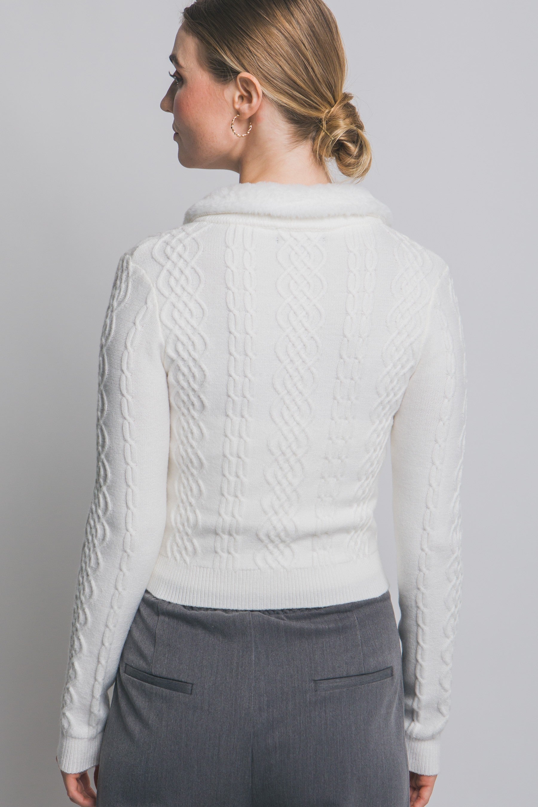 The Colette Faux-Fur Collared Cardigan adds vintage-inspired charm with its soft knit texture and plush faux-fur trim.