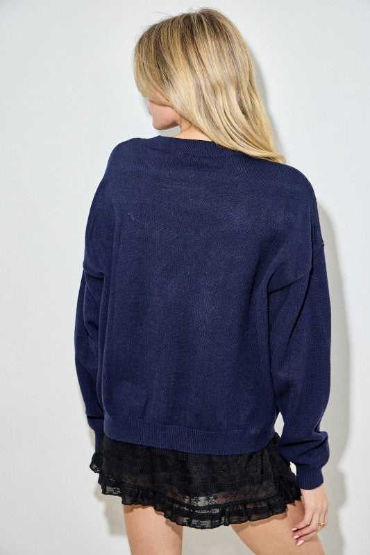 The Daphne Schnauzer Intarsia Sweater brings playful charm and cozy comfort together in a chic, statement knit.