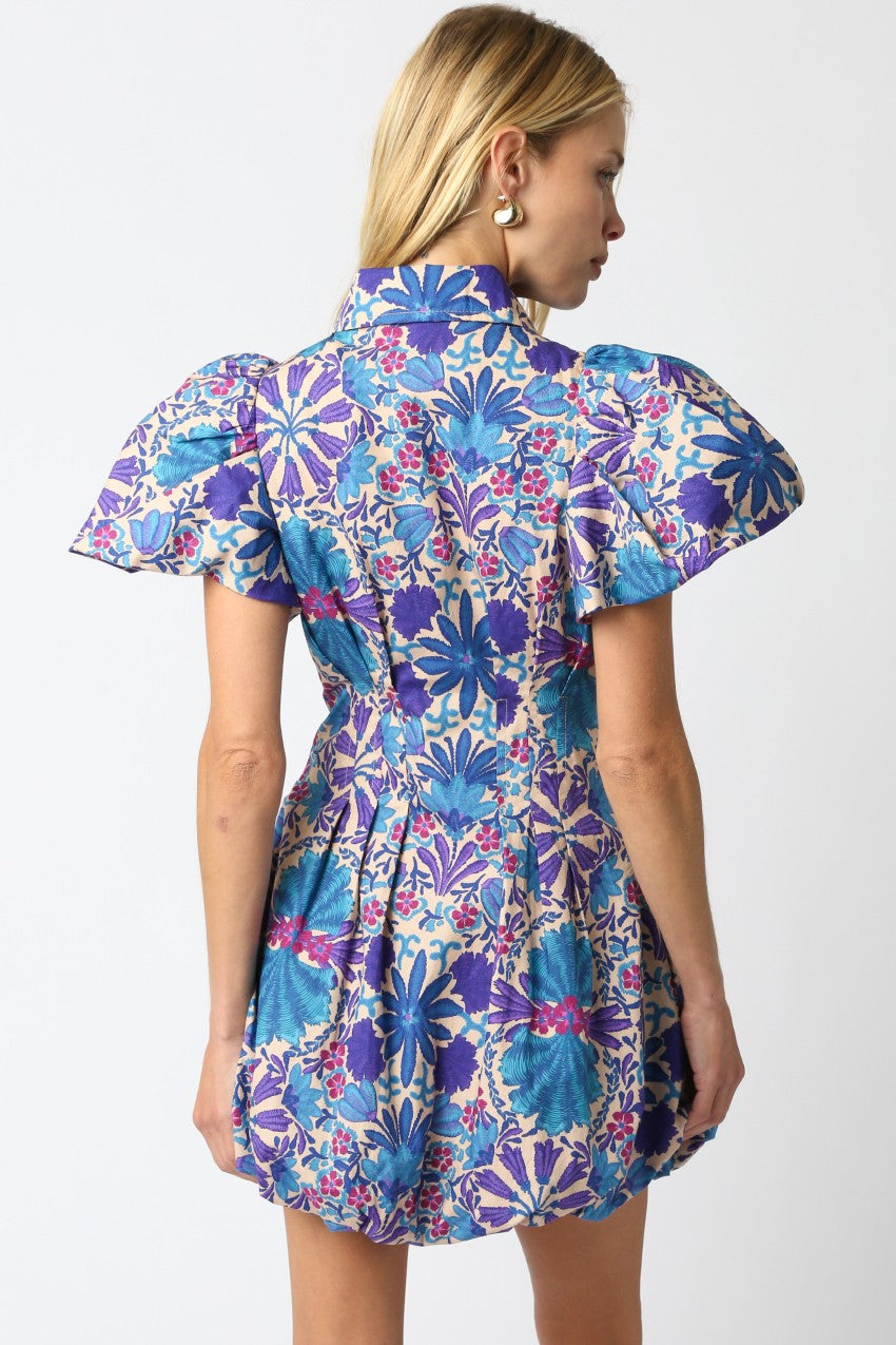 The Nola dress brings playful charm with its floral print, bubble hem, and flattering silhouette.
