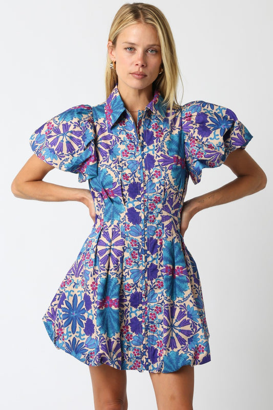 The Nola dress brings playful charm with its floral print, bubble hem, and flattering silhouette.