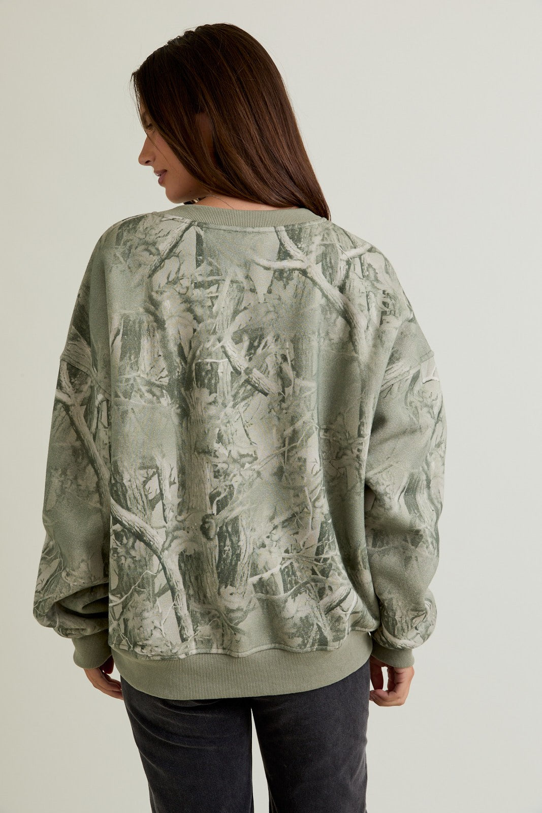 The Delaney sweatshirt combines cozy comfort with bold tree camo print for casual, outdoors-ready style.
