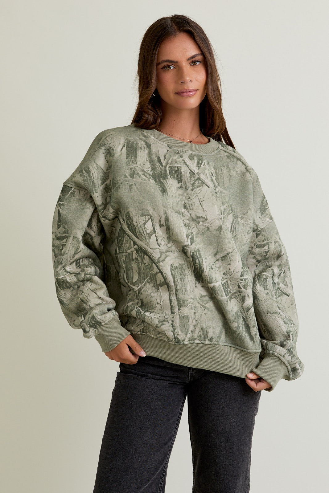 The Delaney sweatshirt combines cozy comfort with bold tree camo print for casual, outdoors-ready style.