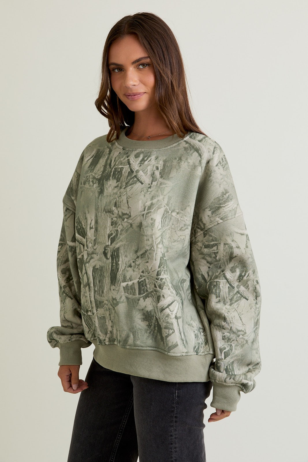 The Delaney sweatshirt combines cozy comfort with bold tree camo print for casual, outdoors-ready style.