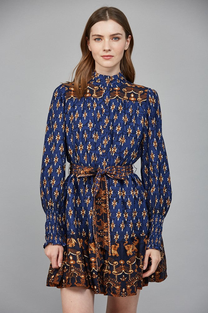 The Isla mini dress stuns with a high neck collar band, delicate ruffles, and an effortlessly feminine silhouette.