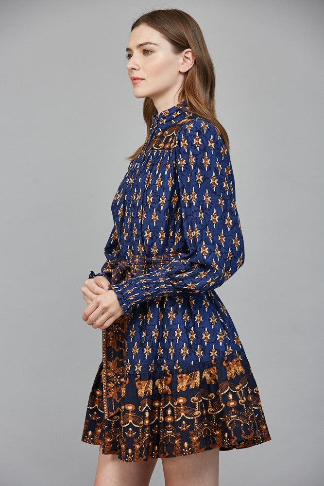 The Isla mini dress stuns with a high neck collar band, delicate ruffles, and an effortlessly feminine silhouette.