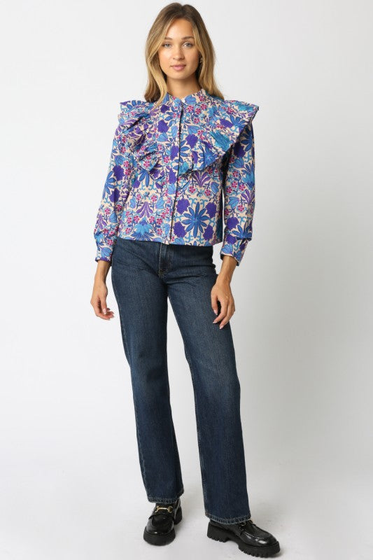 The Elowen Floral Ruffle Shirt blends effortless charm with timeless feminine details.