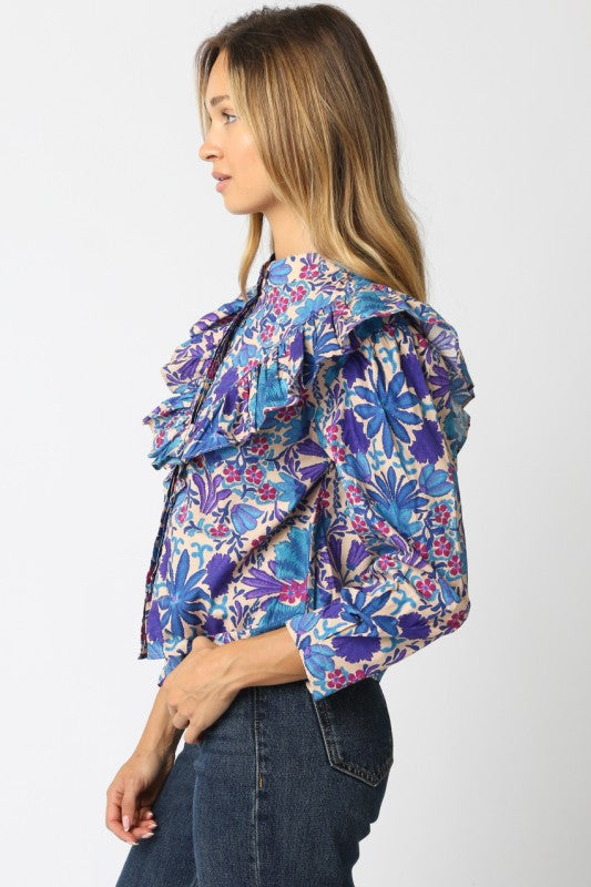 The Elowen Floral Ruffle Shirt blends effortless charm with timeless feminine details.