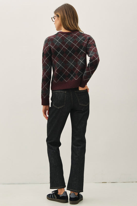 Classic meets cozy—the Lenora cardigan features timeless argyle, soft-touch fabric, and horn button detailing.