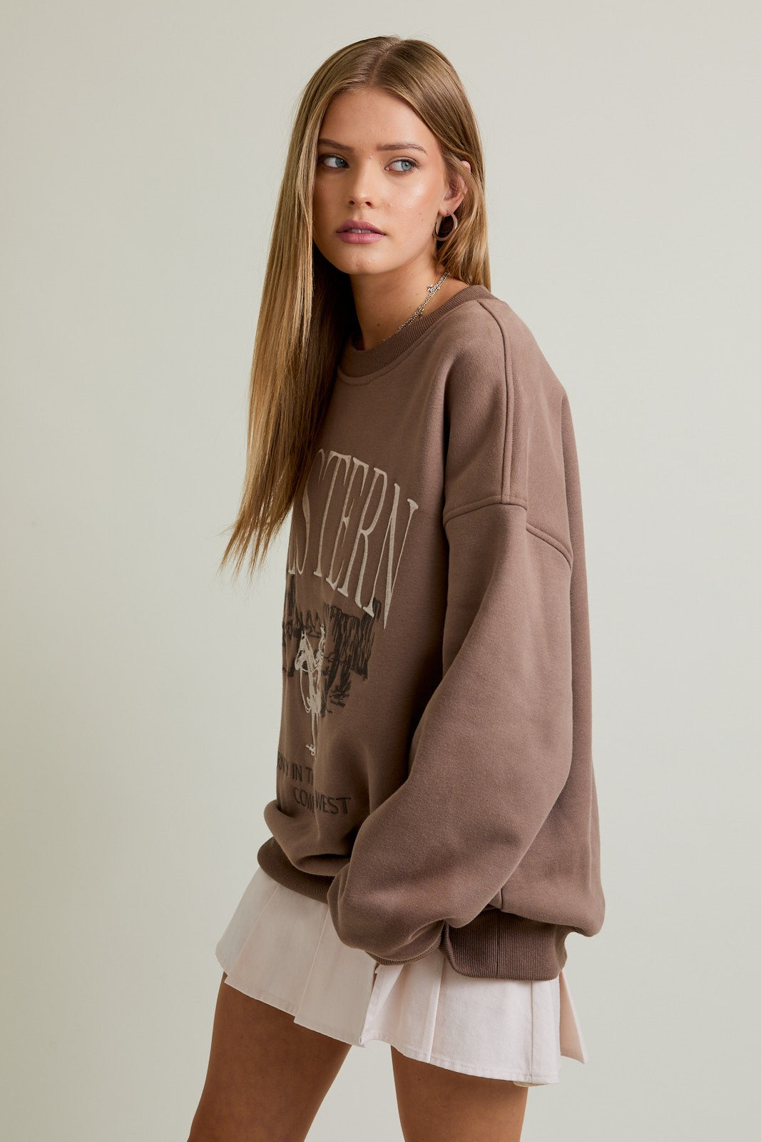 The Cheyenne&nbsp;sweatshirt pairs oversized comfort with a bold “Cowboy” embroidered design for western-inspired style.