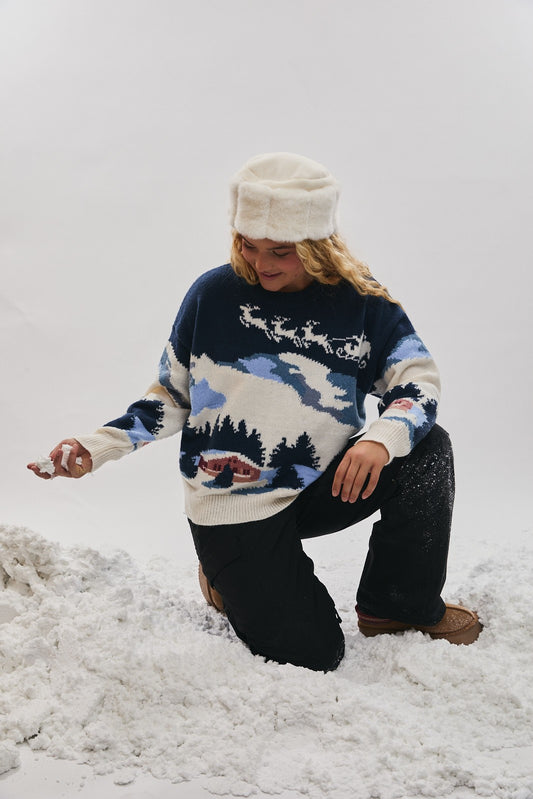 Bring the slopes to your style with this cozy Ski Village sweater — warm, playful, and perfect for winter layering.