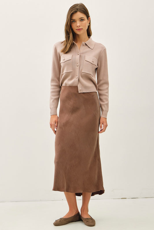 Soft, flowy, and flattering—the Rowena midi skirt brings luxe texture to an everyday silhouette.