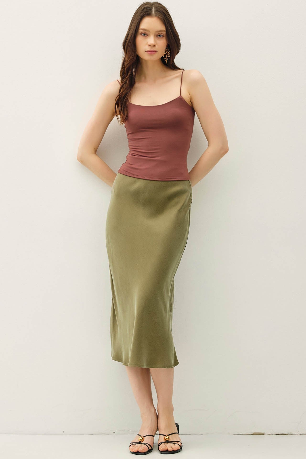 Soft, flowy, and flattering—the Rowena midi skirt brings luxe texture to an everyday silhouette.
