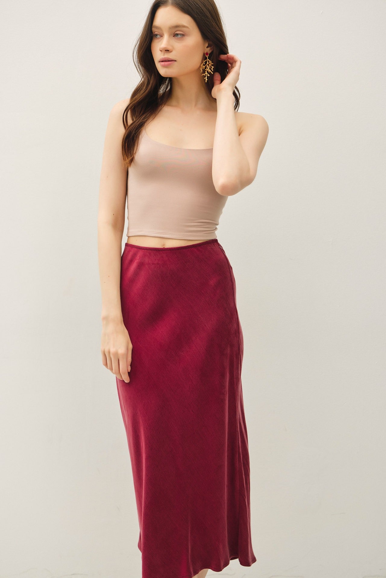 Soft, flowy, and flattering—the Rowena midi skirt brings luxe texture to an everyday silhouette.