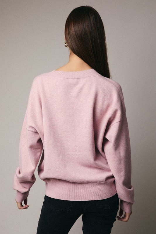 The Clarimond “Merry Martini” Sweater serves up festive cheer with playful holiday flair.