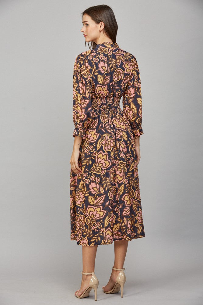 Floral print midi dress with gathered waist and front zip closure.