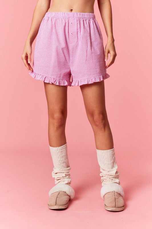 Gingham ruffled shorts with embroidered ‘Cheers’ lettering on 100% cotton fabric.