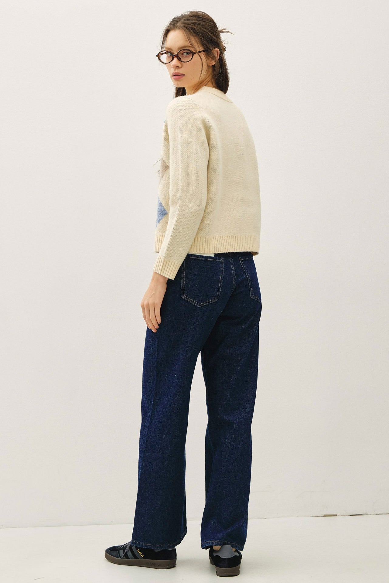 A timeless cardigan with a soft, cozy feel and elegant horn button detailing.