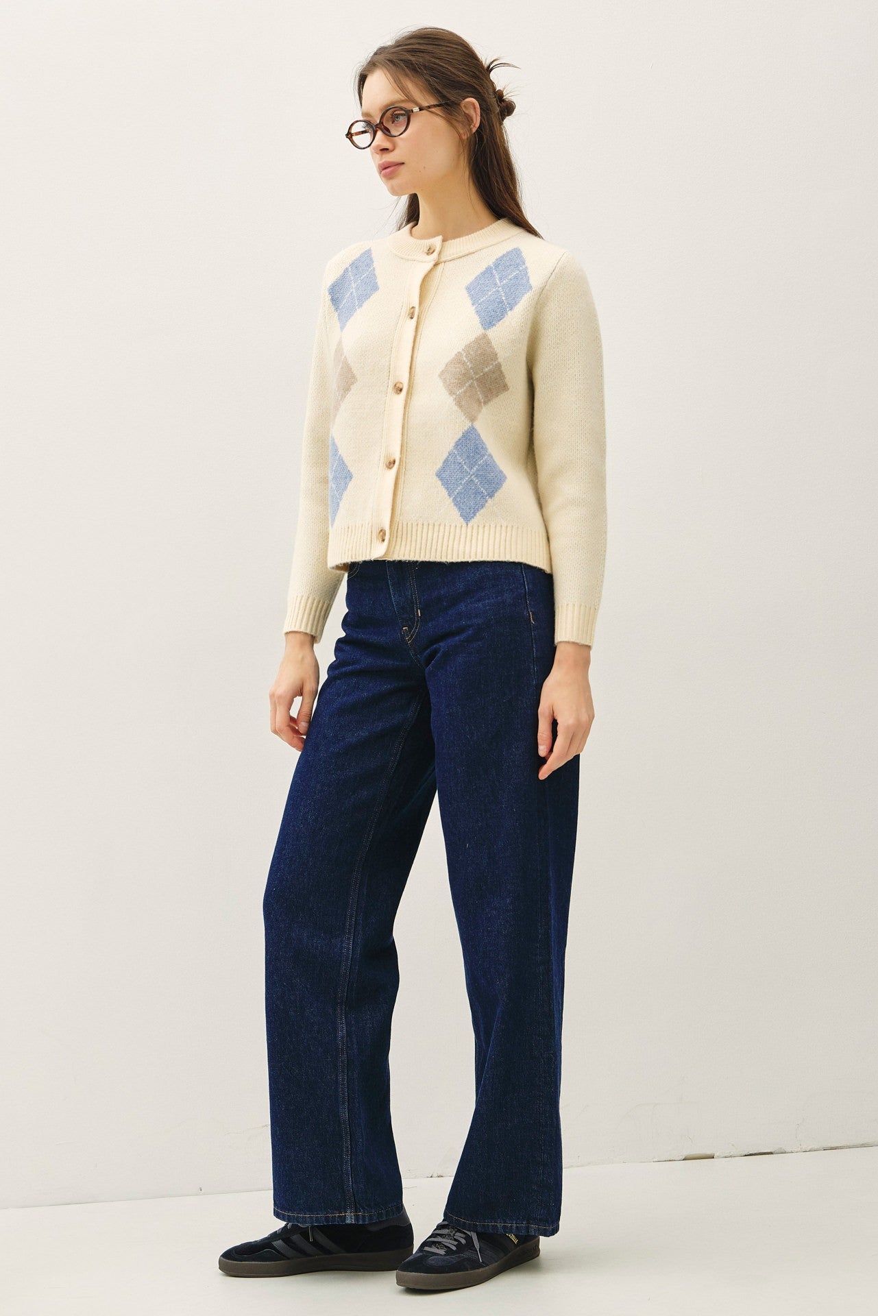 A timeless cardigan with a soft, cozy feel and elegant horn button detailing.
