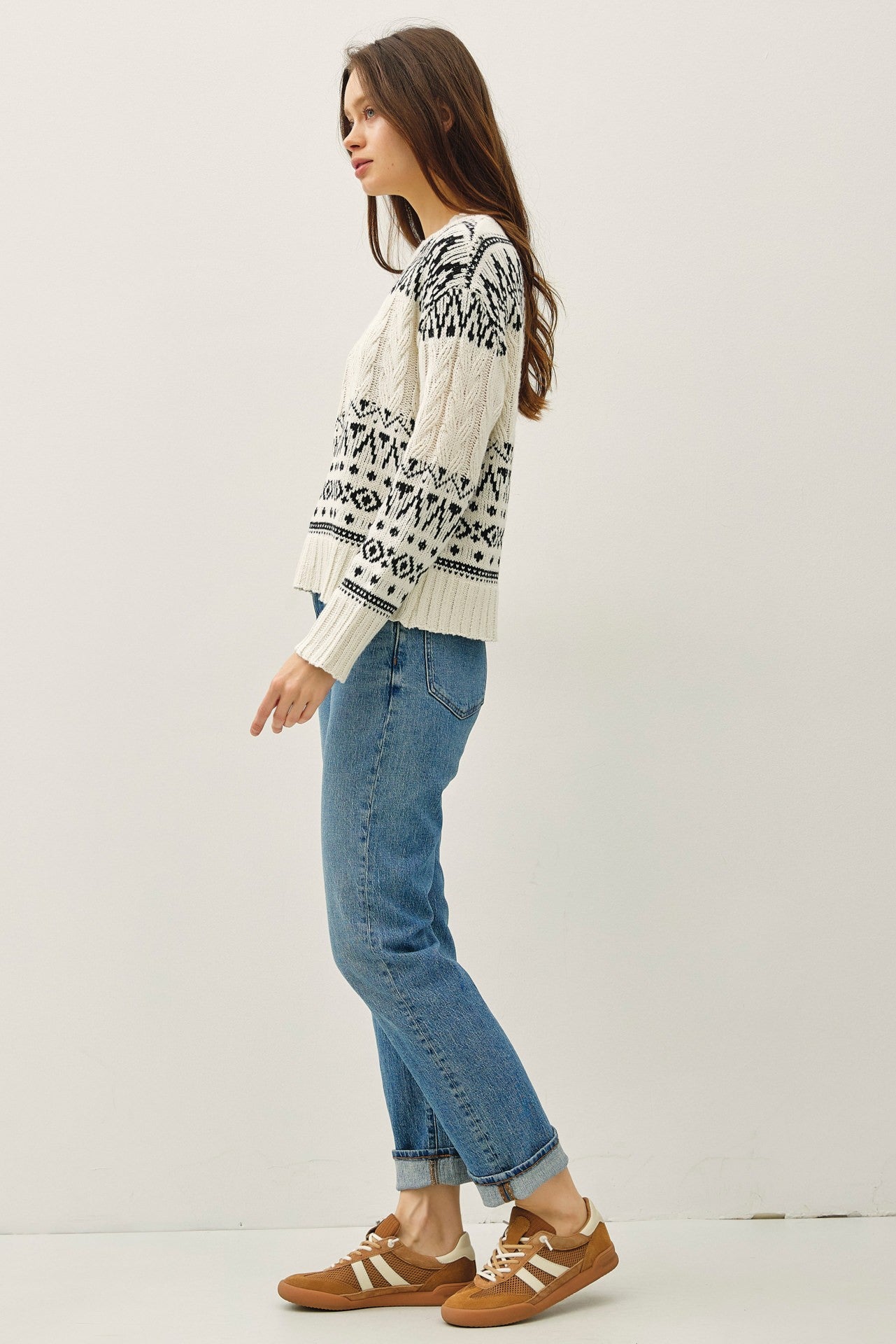 A cozy Fair Isle sweater with cable knit texture and a relaxed, oversized fit — the perfect blend of comfort and charm.