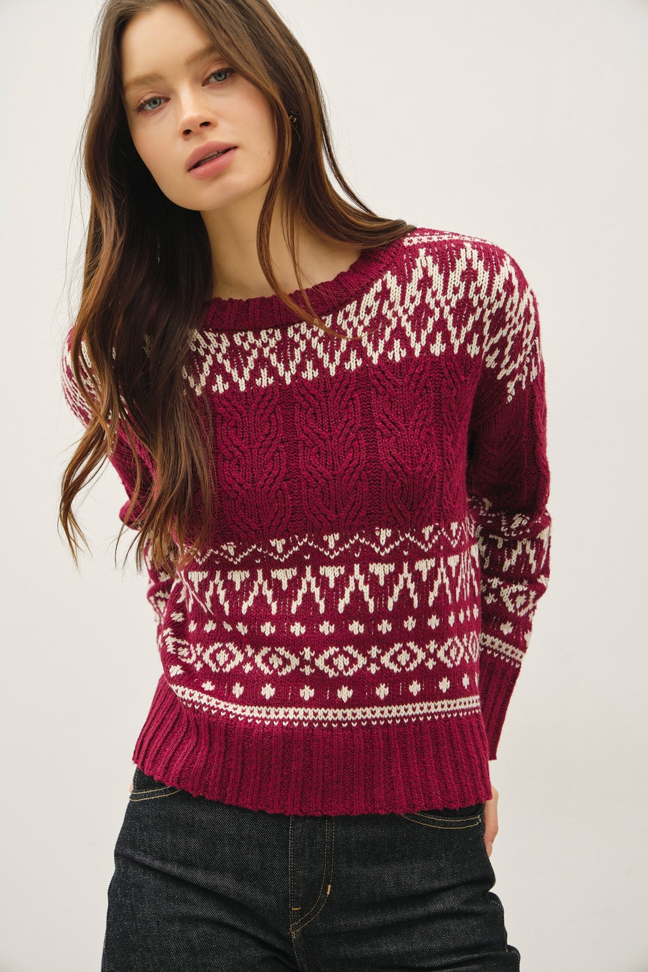 A cozy Fair Isle sweater with cable knit texture and a relaxed, oversized fit — the perfect blend of comfort and charm.