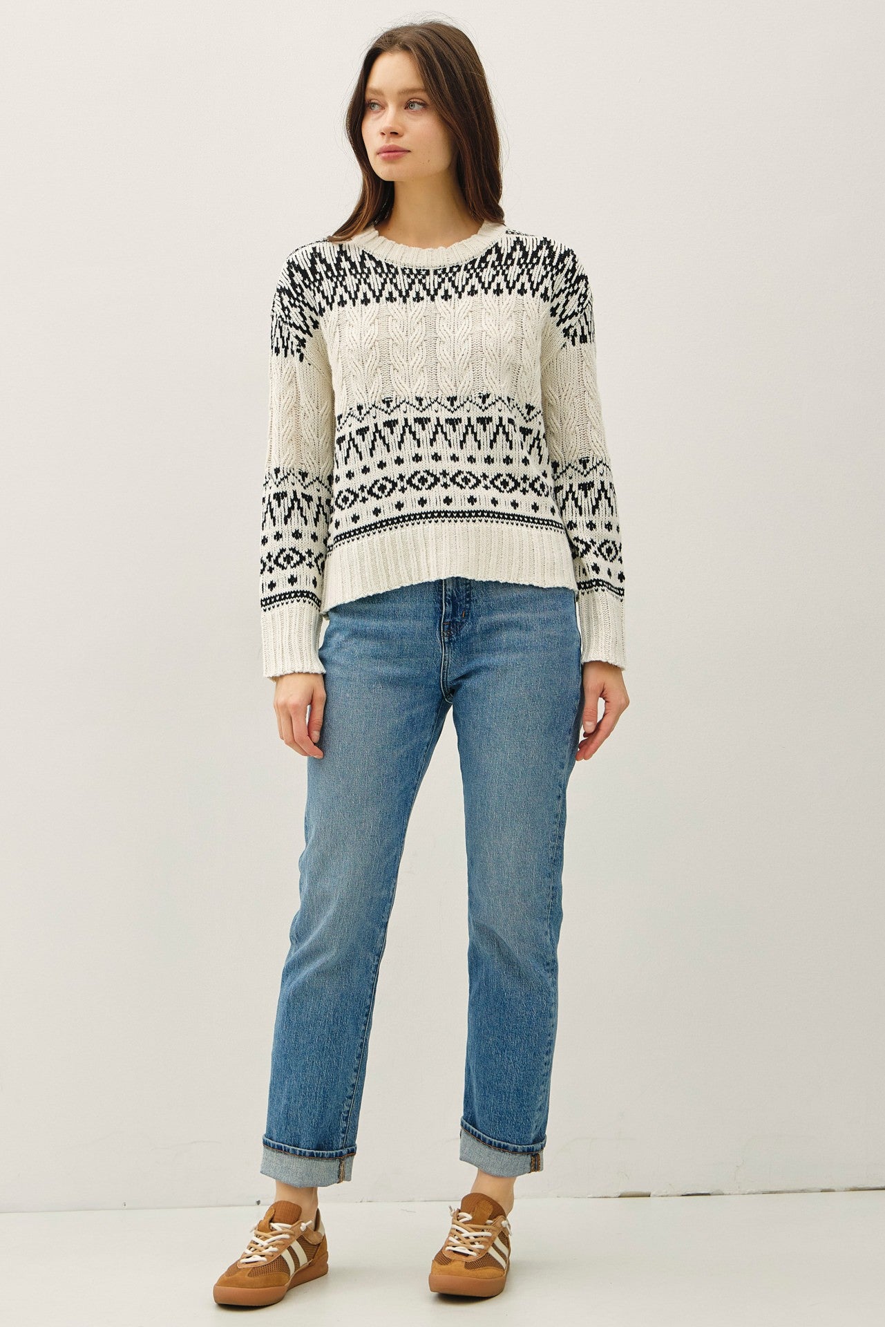 A cozy Fair Isle sweater with cable knit texture and a relaxed, oversized fit — the perfect blend of comfort and charm.