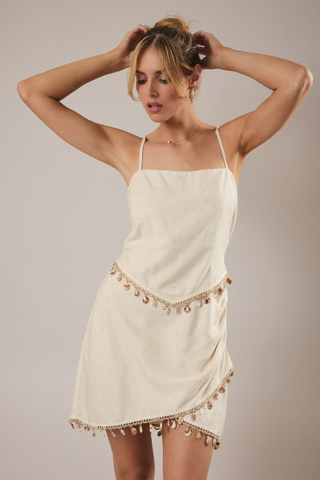 Boho coastal style mini dress with shell detailing and linen blend fabric
