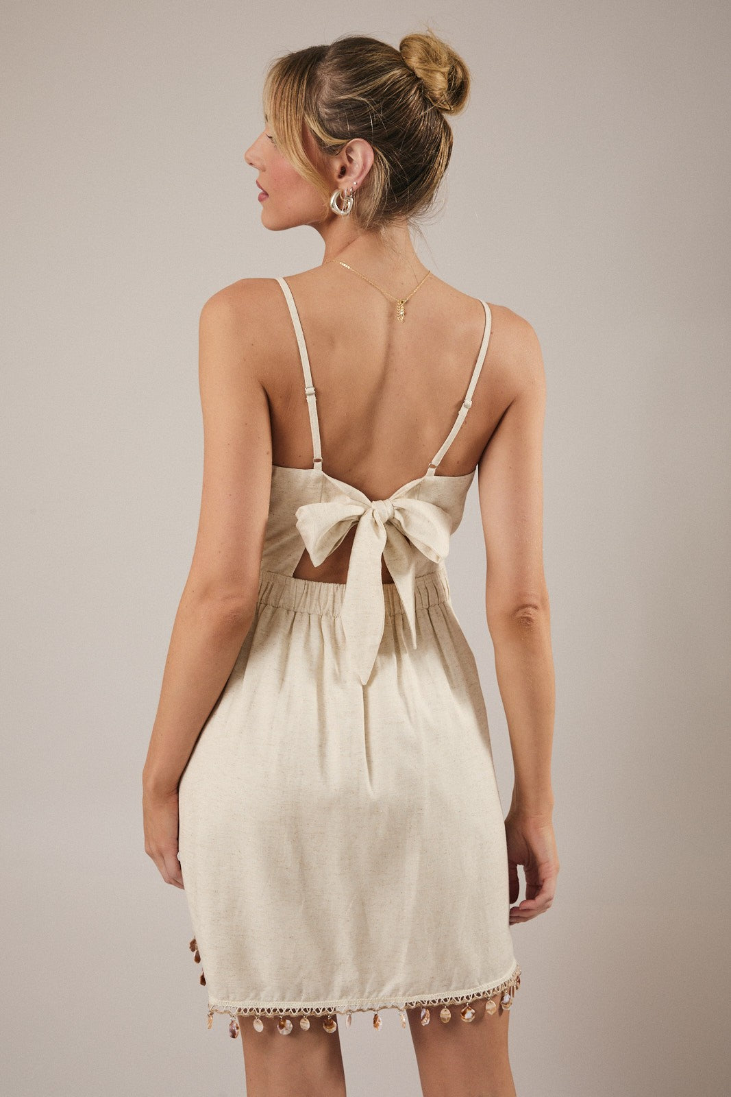 Boho coastal style mini dress with shell detailing and linen blend fabric