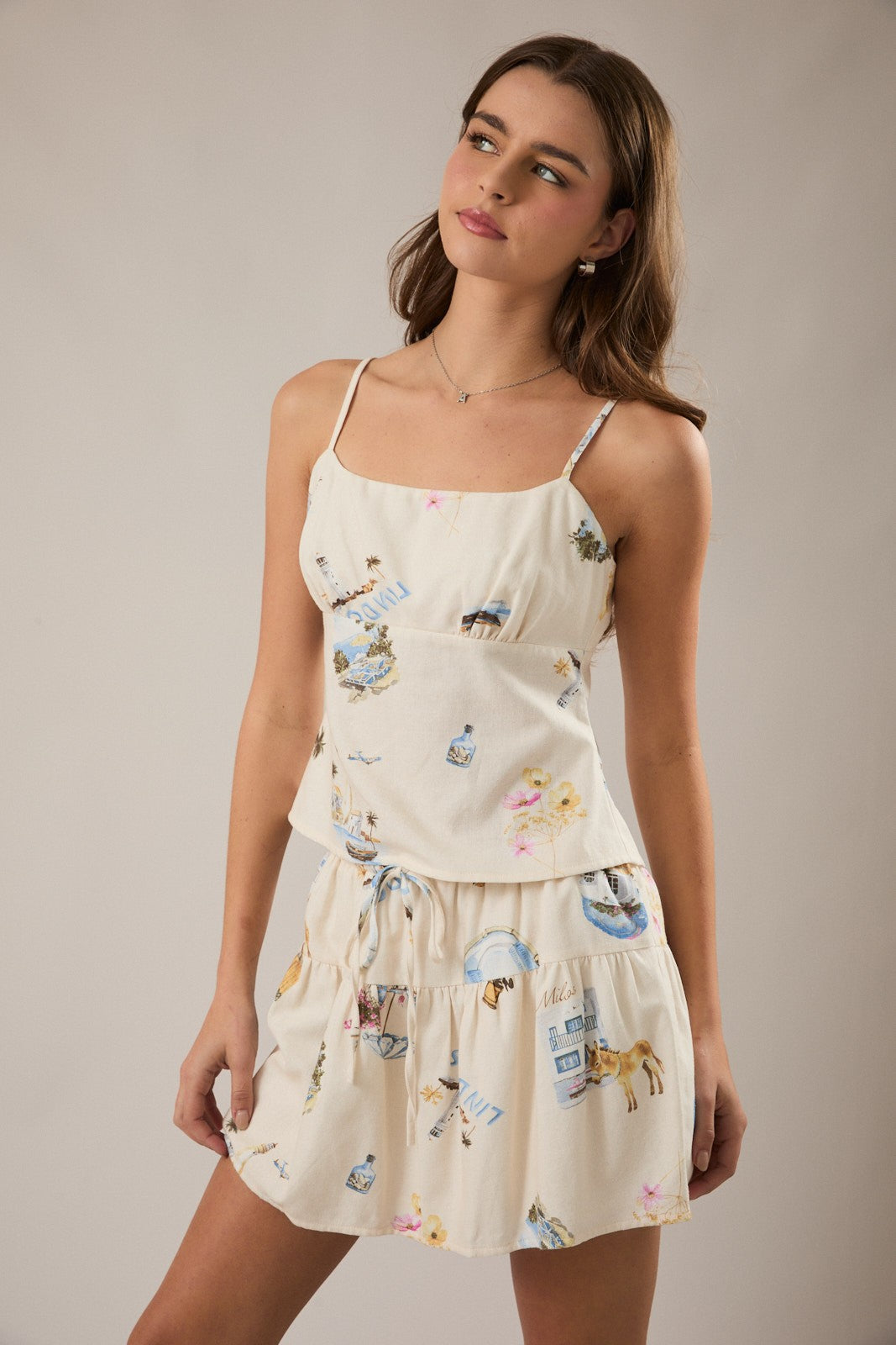 Linen blend spaghetti strap top with adjustable back tie and tropical pattern