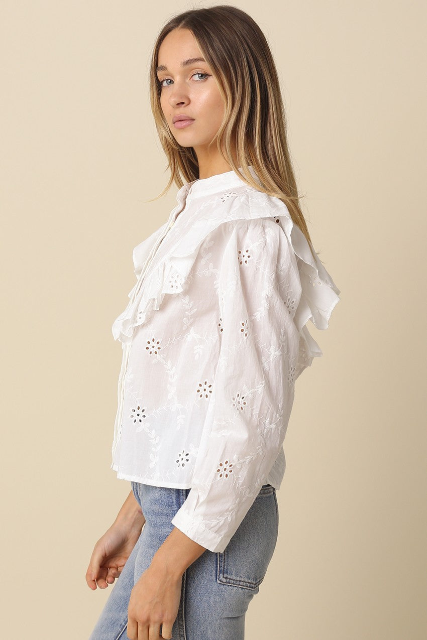 Women’s cotton eyelet blouse with oversized front ruffle and button front
