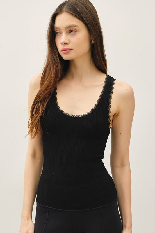 Lace trimmed ribbed tank top with scoop neckline.