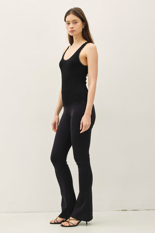 Lace trimmed ribbed tank top with scoop neckline.