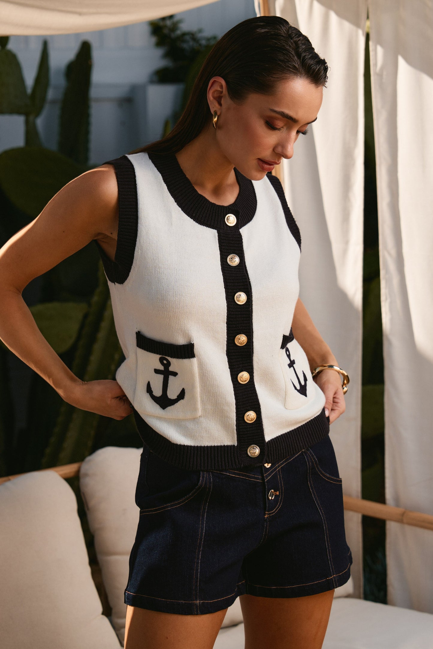 Contrast Anchor Knit Vest features nautical-inspired contrast trim, gold button accents, and a classic sleeveless silhouette