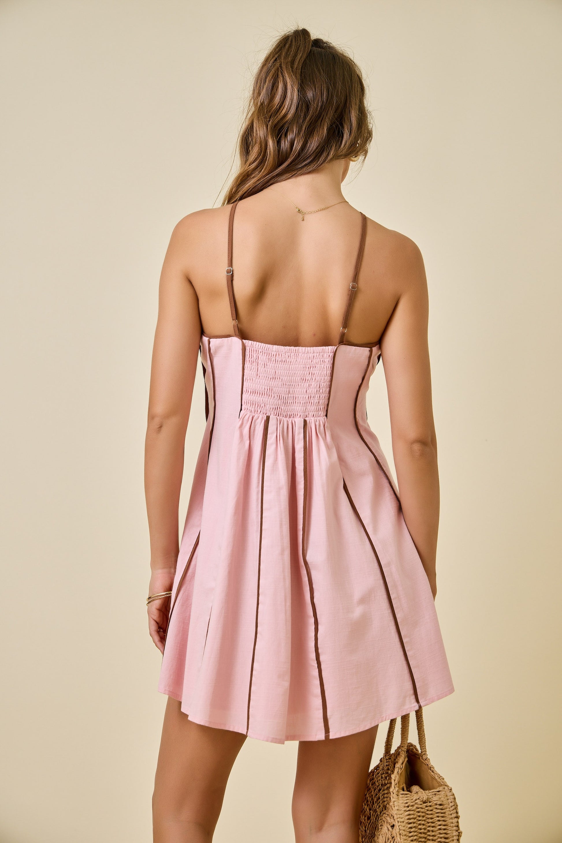 pink halter dress with brown vertical stripes