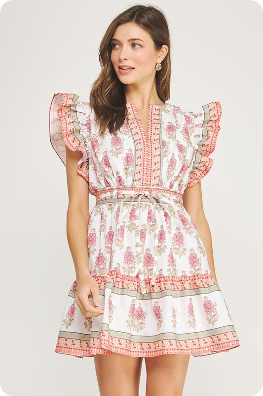 cotton poplin mini dress with ruffle sleeves, a cinched waist, and tiered skirt in a floral block print