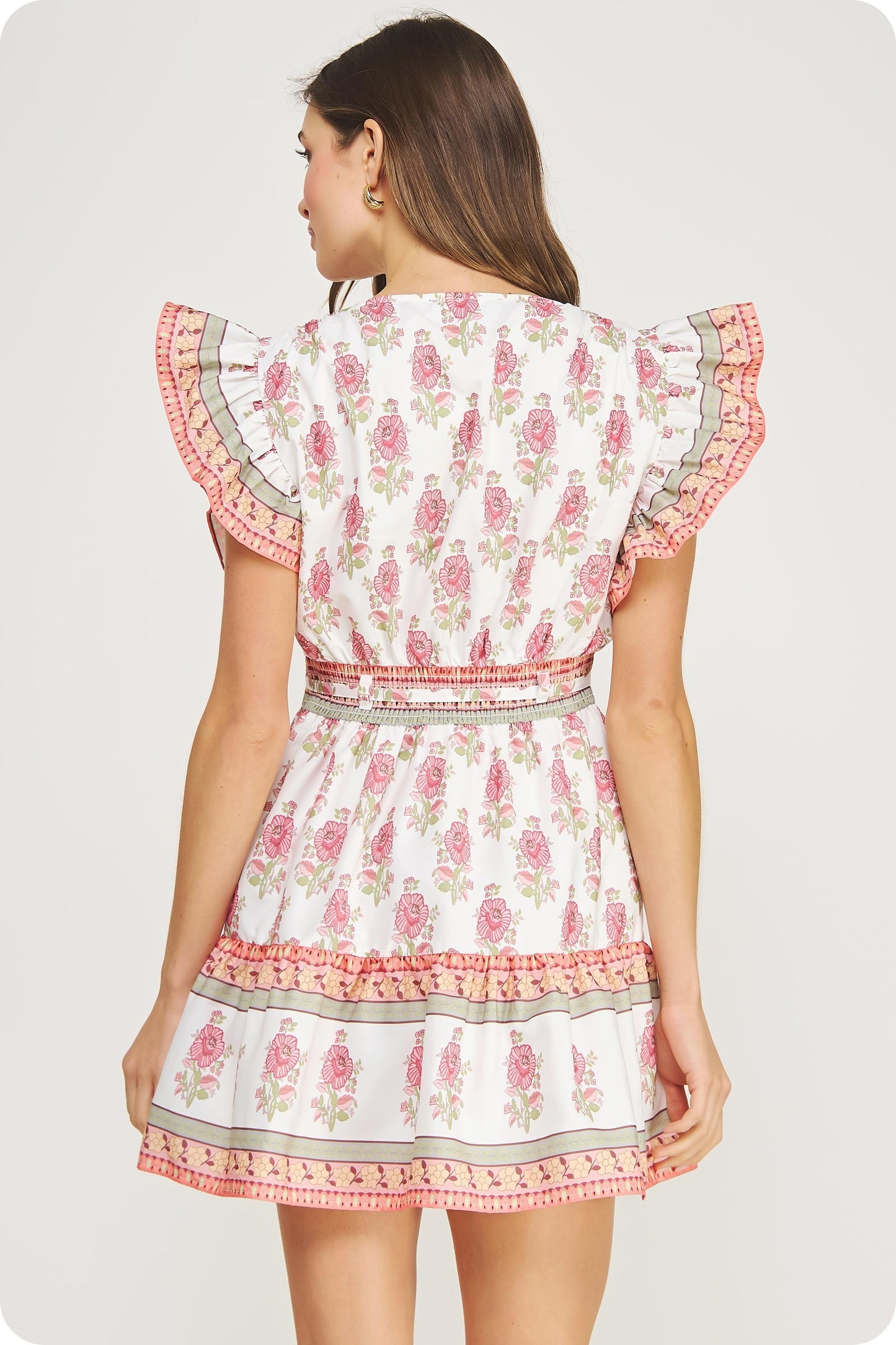 cotton poplin mini dress with ruffle sleeves, a cinched waist, and tiered skirt in a floral block print