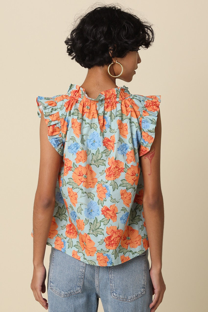 light blue floral ruffle-sleeve women’s top with orange and blue flowers, relaxed fit, and V-neckline