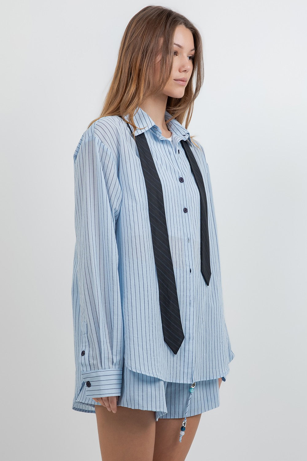  Pinstripe Shirt combines classic sophistication with a detachable contrast neck 