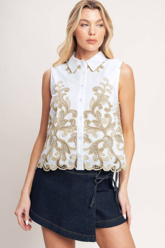 Embroidered Sleeveless Top features delicate embroidery, a classic collar, and a polished button-down front