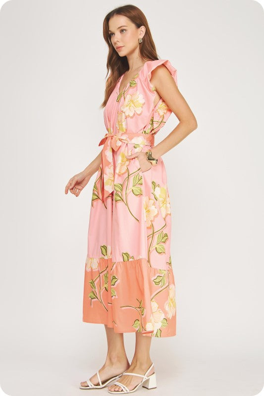 V-neck tropical hibiscus midi dress with ruffle sleeves, a tiered skirt, and a removable sash belt