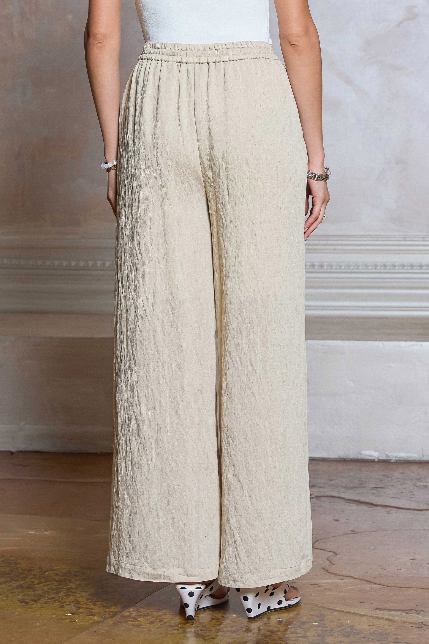 Drawstring Pants feature a wide leg silhouette, elastic waistband, and lightweight textured fabric