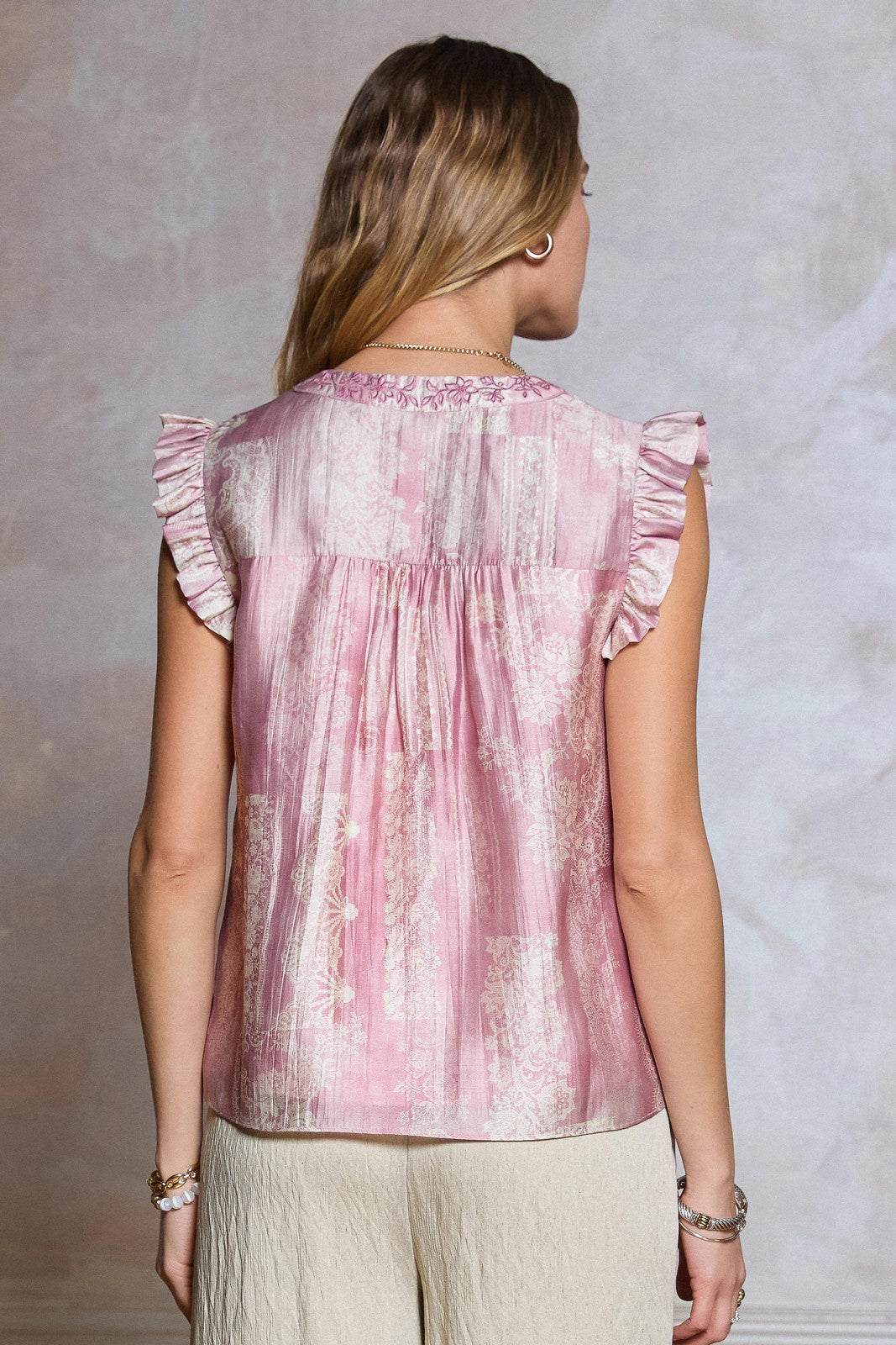 Floral Embroidered Blouse features a lace-inspired floral print, delicate embroidery, and ruffled sleeves