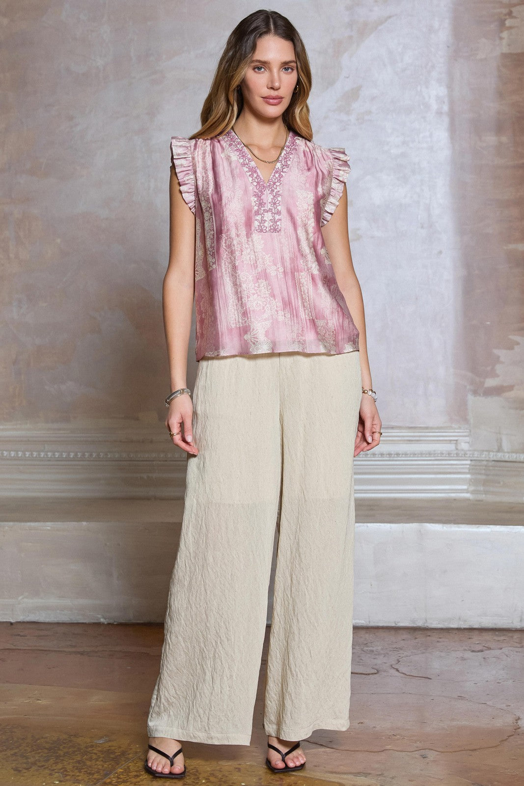 Floral Embroidered Blouse features a lace-inspired floral print, delicate embroidery, and ruffled sleeves