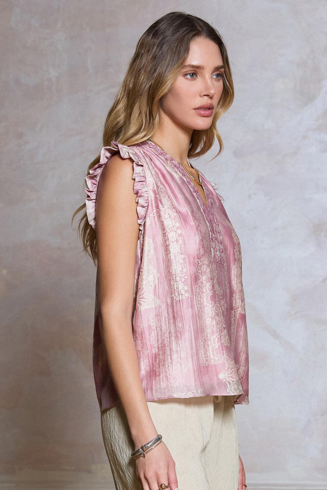 Floral Embroidered Blouse features a lace-inspired floral print, delicate embroidery, and ruffled sleeves