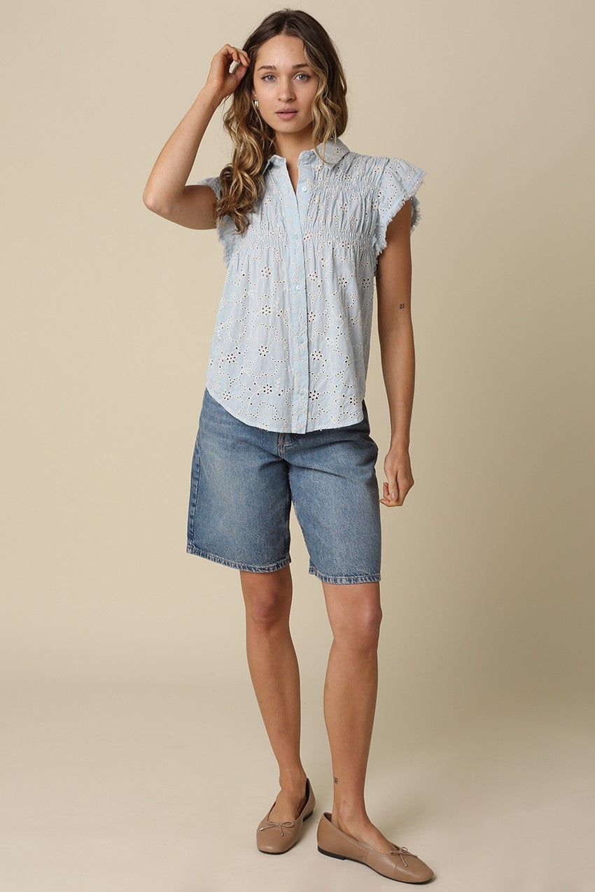 Anne pintuck flutter sleeve top featuring vertical pintuck detail, front button closure, and soft cap sleeves.