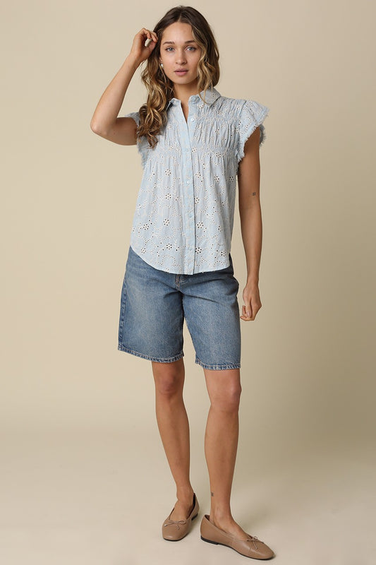 Anne pintuck flutter sleeve top featuring vertical pintuck detail, front button closure, and soft cap sleeves.