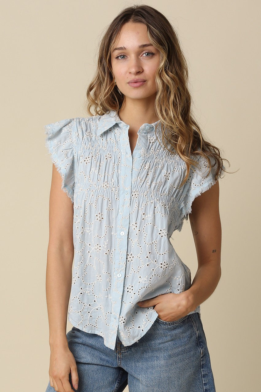 Anne pintuck flutter sleeve top featuring vertical pintuck detail, front button closure, and soft cap sleeves.