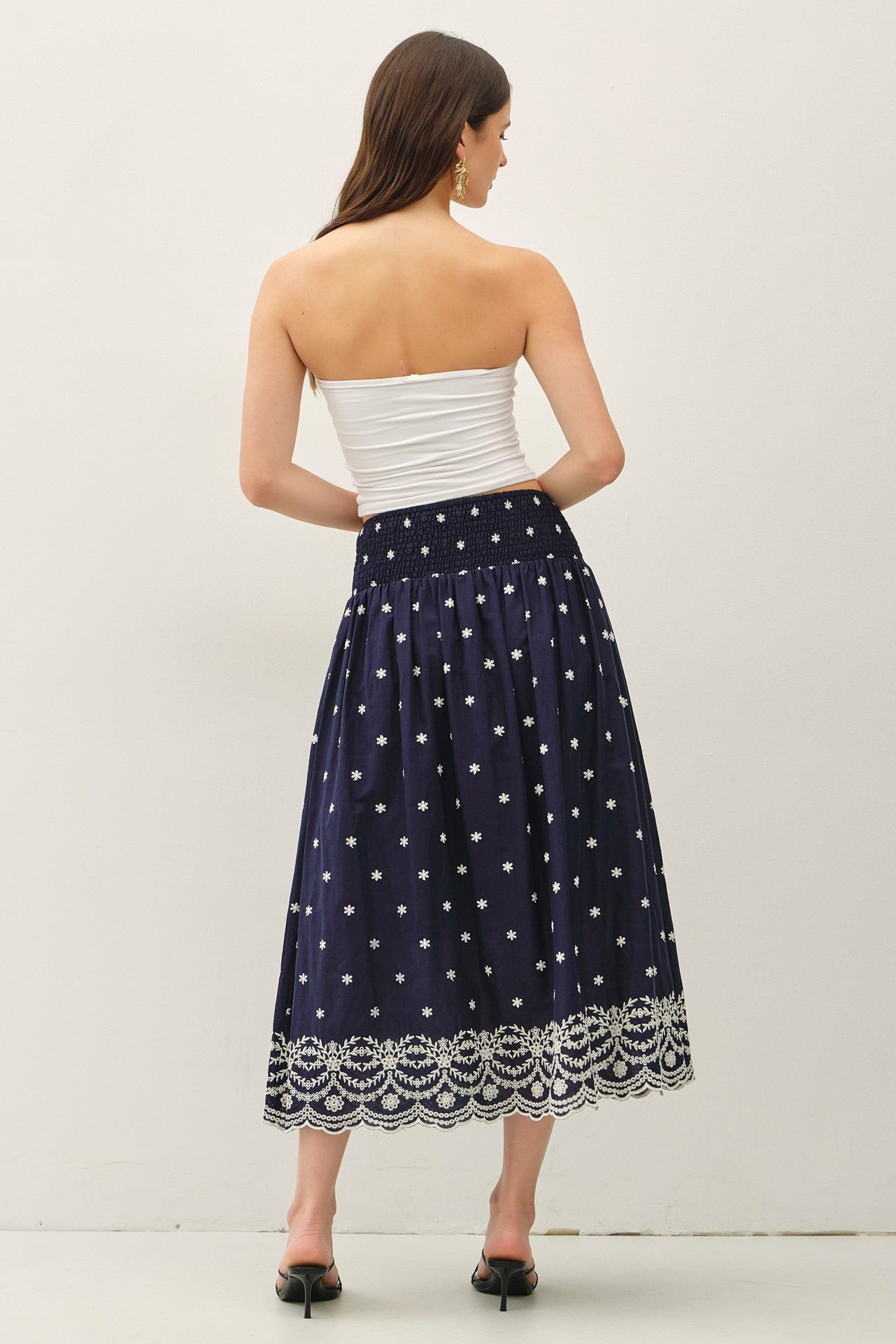 embroidered midi skirt with a scalloped hem and flowy high-waist silhouette